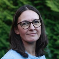 Female with brown hair and glasses